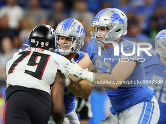 Offensive tackle Matt Nelson (67) of the Detroit Lions holds the line against defensive tackle Jalen Dalton (79) of the Atlanta Falcons duri...