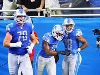 Tight end Devin Funchess (13) of the Detroit Lions holds the ball in the end zone after making a touchdown during an NFL preseason football...