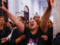 People react during the funeral of victims, who died due to the fire that broke out at the Abu Sifin church, inside the Church of the Blesse...