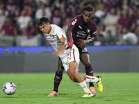 Paulo Dybala of AS Roma and Lassana Coulibaly of US Salernitana 1919 compete for the ball during the Serie A match between US Salernitana 19...