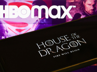 'House of the Dragon' series logo displayed on a phone screen and HBO Max website displayed on a laptop screen are seen in this illustration...