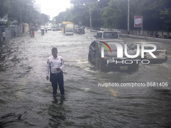 Vehicles drive through a flooded road after heavy rain in Yangon, Myanmar on August 17, 2022.
 (