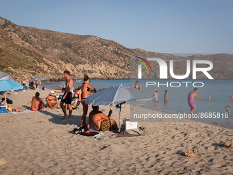 People enjoy their time at Cedar Forest (Kedrodasos) beach in Chania, Crete Island, Greece on August 18, 2022. (