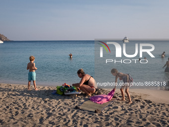 People enjoy their time at Cedar Forest (Kedrodasos) beach in Chania, Crete Island, Greece on August 18, 2022. (