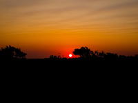 The sunset at Cedar Forest (Kedrodasos) beach in Chania, Crete Island, Greece on August 18, 2022. (