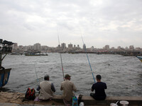 Palestinian fishermen during fishing on a windy day  on Oct. 25, 2015. at the sea port in Gaza City  (