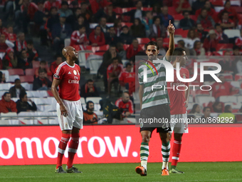 Sporting's forward Bryan Ruiz (C ) celebrates after scoring a goal during the Portuguese League football match SL Benfica vs Sporting CP at...