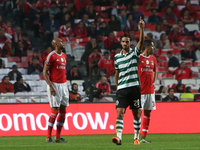 Sporting's forward Bryan Ruiz (C ) celebrates after scoring a goal during the Portuguese League football match SL Benfica vs Sporting CP at...