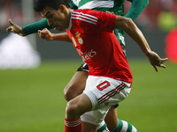 Benfica's midfielder Nicolas Gaitan (F) vies for the ball with Sporting's forward Teofilo Gutierrez (B)  during the Portuguese League  footb...
