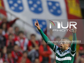 Sporting's forward Islam Slimani celebrates his goal during the Portuguese League  football match between SL Benfica and Sporting CP at Luz...