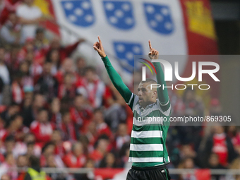 Sporting's forward Islam Slimani celebrates his goal during the Portuguese League  football match between SL Benfica and Sporting CP at Luz...