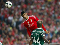 Benfica's forward Raul Jimenez  (L)  vies for the ball with Sporting's defender Naldo (R)  during the Portuguese League  football match betw...