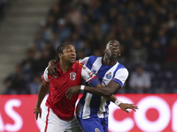 Braga's Brazilian forward Alan and Porto's French defender Aly Cissokho during the Premier League 2015/16 match between FC Porto and SC Brag...