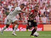 Iker Muniain Left Winger of Athletic and Spain and Samuel Lino Left Winger of Valencia and Brazil compete for the ball during the La Liga Sa...