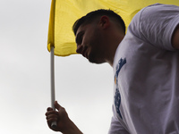 A man holds Ukrainian flag during a demonstration on Independence Day of Ukraine at the Main Square in Krakow, Poland on  August 24, 2022. T...