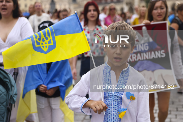 An Ukrainian boy attends a demonstration on Independence Day of Ukraine in Krakow, Poland on  August 24, 2022. The day marks the 31st annive...
