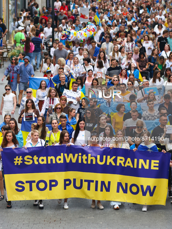 People hold #StandWithUkraine banner during a demonstration on Independence Day of Ukraine in Krakow, Poland on  August 24, 2022. The day ma...