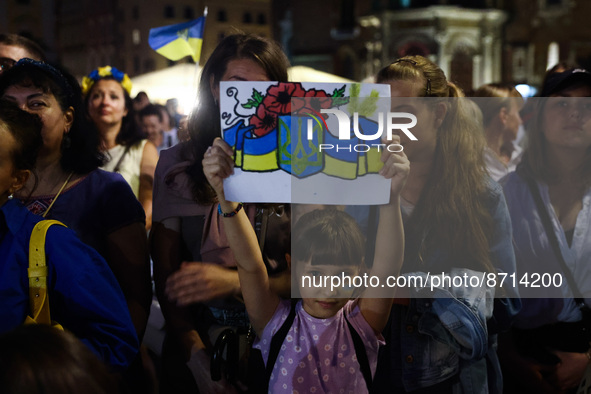 People attend an evening concert on Independence Day of Ukraine in Krakow, Poland on  August 24, 2022. The day marks the 31st anniversary of...