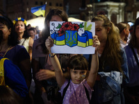People attend an evening concert on Independence Day of Ukraine in Krakow, Poland on  August 24, 2022. The day marks the 31st anniversary of...