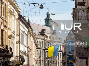 An Ukrainian national flag is seen in the old town of Lviv, Ukraine as the country surpasses 6 months of war with Russia on August 26, 2022....