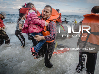 A father carries his daughter off their boat which was stranded in the water for five hours without a motor. The waves and current carried t...
