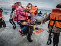 A father carries his daughter off their boat which was stranded in the water for five hours without a motor. The waves and current carried t...