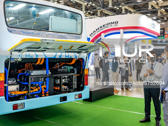 Visitors look at a exhibition booth displayed an hydrogen bus during the H2 MEET 2022 expo in KINTEX(Korea International Exhibition Center)...