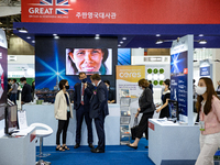 Visitors look at a exhibition booth displayed by United Kingdom during the H2 MEET 2022 expo in KINTEX(Korea International Exhibition Center...