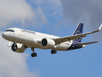 Lufthansa Airbus A320neo aircraft as seen flying over Myrle Avenue and landing at London Heathrow Airport. The modern and advanced A320 narr...