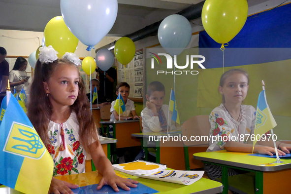 ODESA, UKRAINE - SEPTEMBER 1, 2022 - Children displaced by the war sit at the desks decorated with balloons during a celebration organised b...