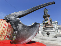 A model of execution ax is seen during a rally with demand to remove the monument to the Empress of Russia Catherine II which is installed i...