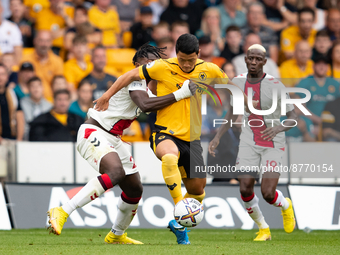 Mohammed Salisu of Southampton and Wolvess Hwang Hee-chan (R) during the Premier League match between Wolverhampton Wanderers and Southampto...