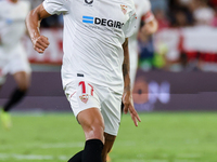 Erik Lamela of Sevilla FC runs with the ball during the La Liga Santader match between Sevilla CF and FC Barcelona at Ramon Sanchez Pizjuan...