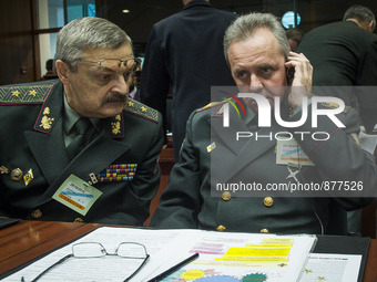 Ukrainian Major Gen Leonid Holopatiuk (L)  and Viktor Muzhenko, Commander-in-Chief of the Armed Forces of Ukraine (R)  prior to the meeting...