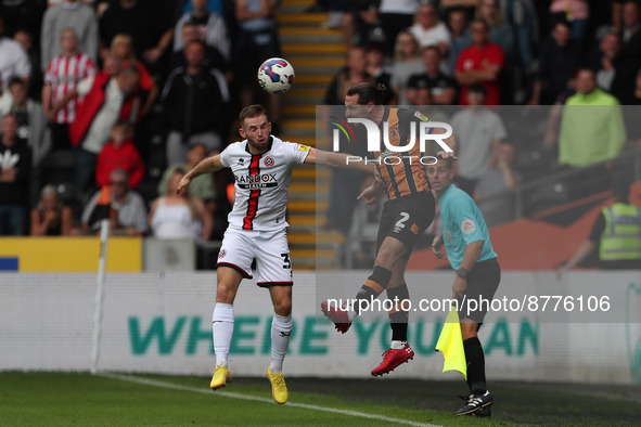 Sheffield United's Rhys Norrington-Davies contests a header with Lewis Coyle of Hull City during the Sky Bet Championship match between Hull...