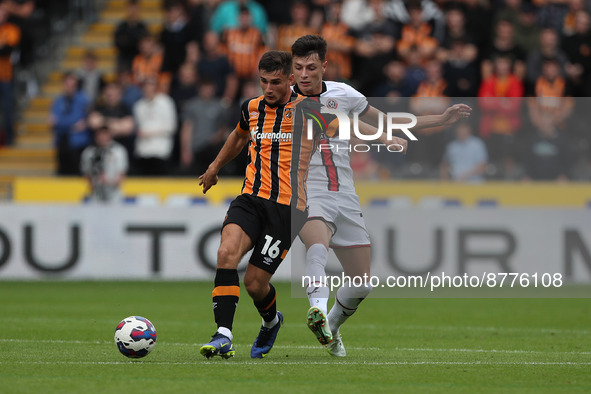 Ryan Longman of Hull City battles with Anel Ahmedhodzic of Sheffield United during the Sky Bet Championship match between Hull City and Shef...