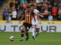 Ryan Longman of Hull City battles with Anel Ahmedhodzic of Sheffield United during the Sky Bet Championship match between Hull City and Shef...