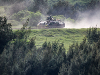 Armored vehicles maneuver during the 2-day live-fire drill, amid intensifying threats military from China, in Pingtung county, Taiwan, 7 Sep...