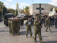Ukrainian servicemen carry the coffin of Vyacheslav Nalyvayko, Ukrainian serviceman,  who was killed in a battle against Russian troops in t...