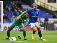 Hallam Hope of Oldham Athletic tussles with Tyrone Williams of Chesterfield Football Club during the Vanarama National League match between...