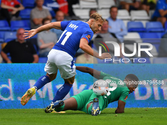 Hallam Hope of Oldham Athletic tussles with Tyrone Williams of Chesterfield Football Club during the Vanarama National League match between...