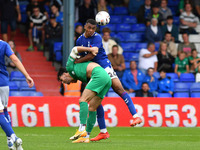 David Okagbue of Oldham Athletic tussles with Joe Quigley of Chesterfield Football Club during the Vanarama National League match between Ol...