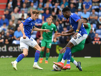Mike Fondop-Talom of Oldham Athletic is fouled by Tyrone Williams of Chesterfield Football Club  during the Vanarama National League match b...