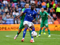 Junior Luamba of Oldham Athletic tussles with Oliver Banks of Chesterfield Football Club  during the Vanarama National League match between...
