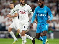 Rodrigo Bentancur of Tottenham and Gerson of Marseille battle for the ball during the UEFA Champions League match between Tottenham Hotspur...