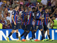 Robert Lewandowski centre-forward of Barcelona and Poland celebrates with Ousmane Dembele right winger of Barcelona and France after scoring...