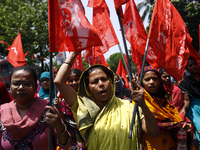 Garment workers form a human chain in Dhaka organized by IndustriALL Bangladesh Council on the eve of one year of Rana Plaza tragedy demandi...
