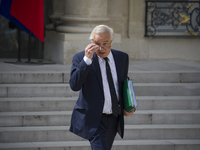 The Minister of Social Affairs and Employment François Rebsamen leaves the Elysee palace on April 23, 2014, in Paris, after the weekly cabin...