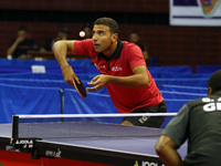 Omar Assar of Egypt competes during the men's final between Quadri Aruna of Nigeria during the ITTF African Senior Championships in Algiers,...