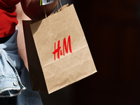 A person carries H&M bag in Krakow, Poland on September 13, 2022. (